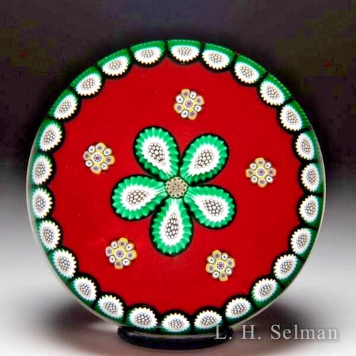 Peter McDougall 2004 millefiori daisy and garland on red ground paperweight