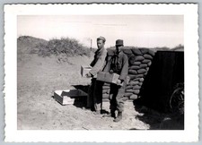 Vtg B&W Snapshot Two Men In Military Uniforms With Boxes Near Sandbags 1950s
