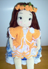 Hand crochet doll with 6 outfits, brown streaked hair. 26" tall #7a