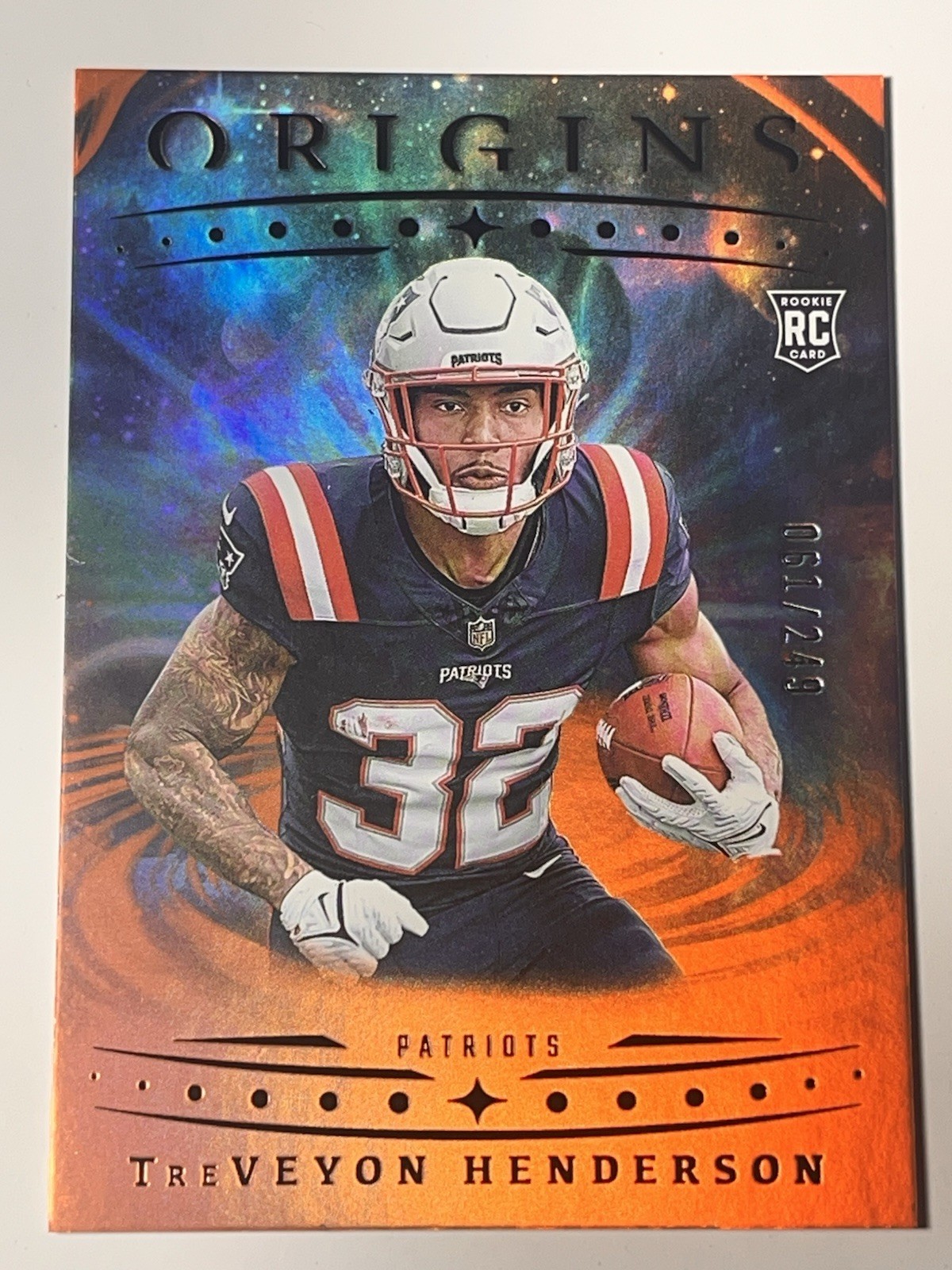 2025 Panini Origins TreVeyon Henderson RC Holo Orange /249 NE Patriots #105