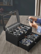 20-compartment watch box, made of black synthetic leather with a gray lining.