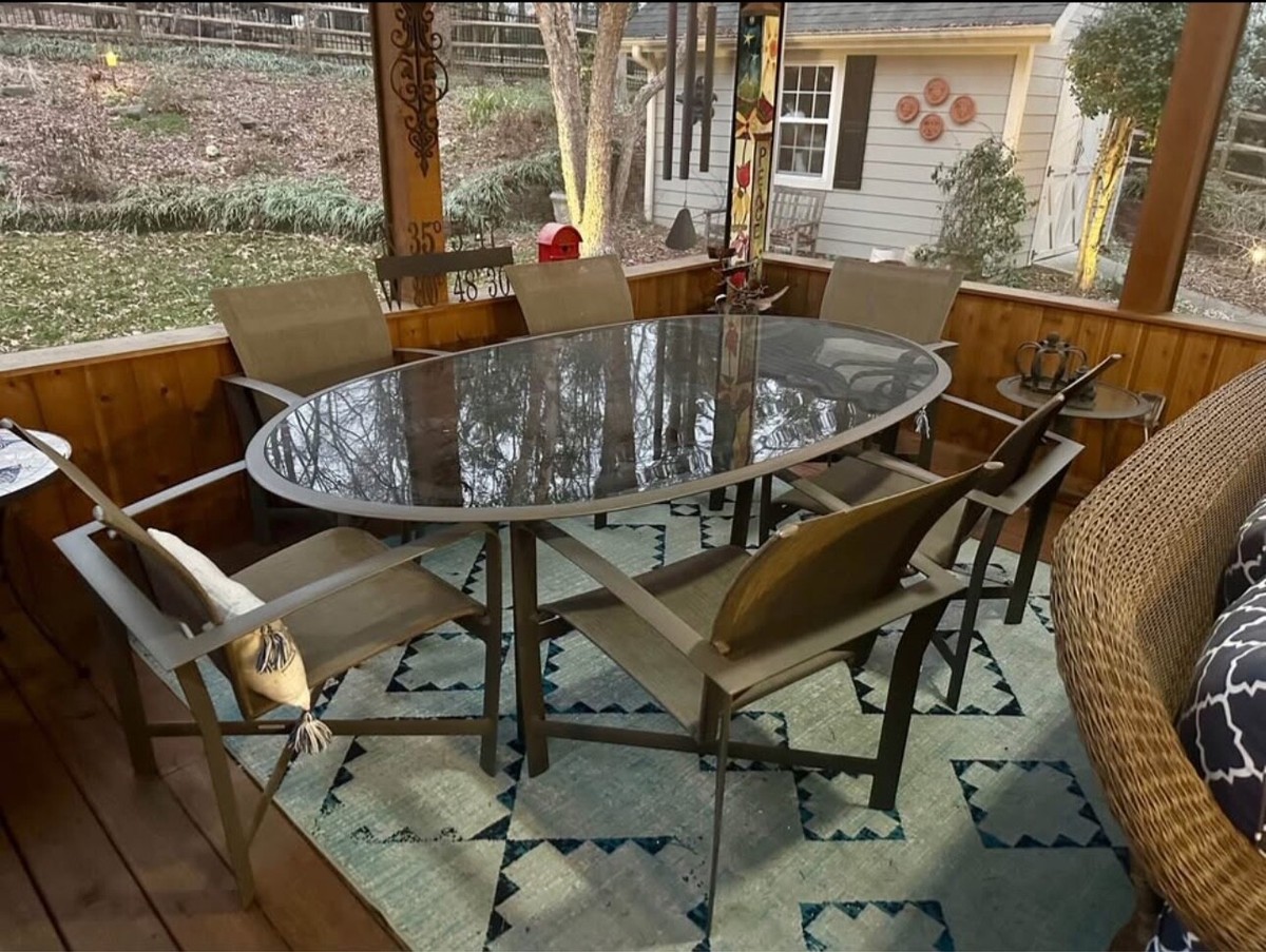 Brown Jordan oval glass top dining table and arm Very