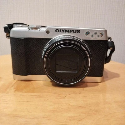 Appareil photo numérique OLYMPUS STYLUS SH-3 zoom optique 24x Wi-Fi design co... - Photo 1/4