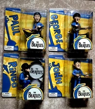 BEATLES ACTION FIGURES SET OF 4 BASED ON THE CLASSIC BEATLES CARTOON.  VERY RARE
