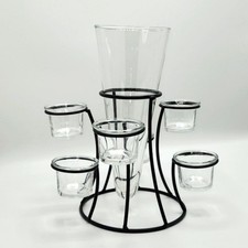 Centro de mesa de hierro rústico con jarrón de vidrio transparente y candelabro votivo Tealight