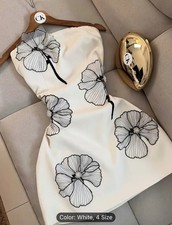 A Sophisticated And Stylish Off-Shoulder Dress.