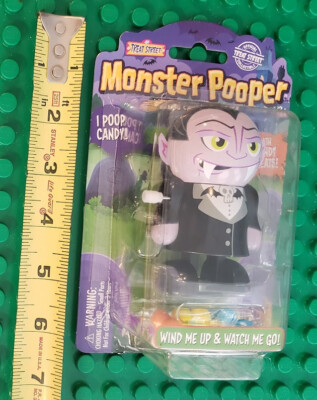 MONSTER POOPER WIND-UP DRACULA & SANTA - NEW BUT BUBBLE SEPARATED FROM BACK