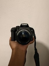 Canon rebel xs eos with battery and neck strap