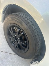 4x Bridgestone Winter Tyres 195/65 R15 on Alloy Wheels with Caps – Complete Set