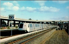 Vintage BART Rapid Transit Train at MacArthur Station Oakland CA Postcard