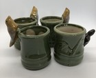 set of four green planters three with birds one with turtle