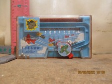 TOMY POCKET BI-PLANE BATTLE POCKET TOY - COVER HAS A CRACK, BUT STILL PLAYS WEL