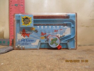 TOMY POCKET BI PLANE BATTLE POCKET TOY COVER HAS A CRACK BUT STILL PLAYS WEL