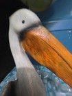 A rustic, stylized pelican figurine — photo 5
