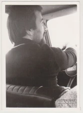 Backseat Glimpse Windshield Driver and the Road Unfolding Ahead Abstract Photo