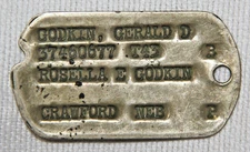 ORIGINAL WWII NAMED BRASS DOG TAG WITH NEXT OF KIN FROM NEBRASKA