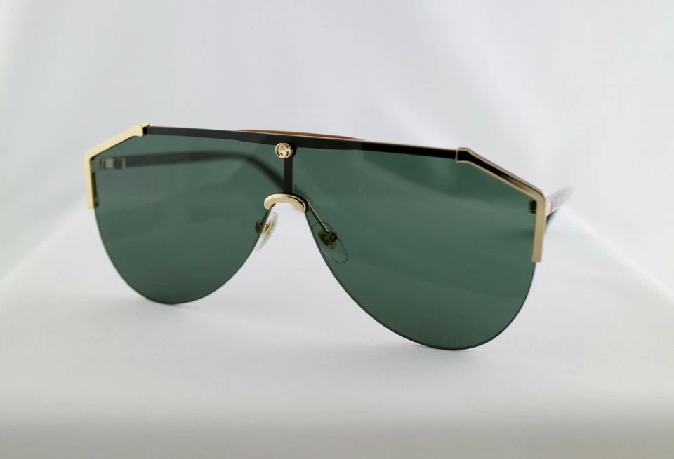 Gafas de sol Gucci GG0584S 002 marco dorado brazos habaneros lentes verdes protector unisex Foto 2 de 4