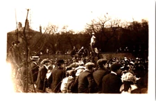 Rppc A group of people watching a military ceremony? vintage postcard a48