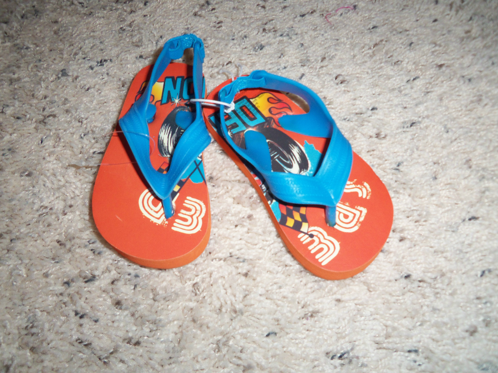 orange and blue flip flops