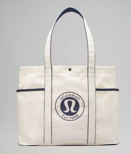 NEW Lululemon Multi-Pocket Cream Canvas Tote Bag Black Trim 20.1" x 5.9" x 13.8