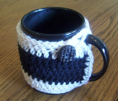 Hand Crochet Tan and Black Buttoned Coffee Mug Cozy - Image 1 of 3