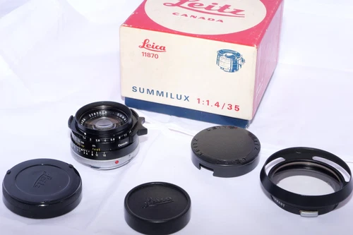 Leica Summilux-M 35mm f/1.4 Wide Angle Lens. Black. Box. Hood with filter. Caps.
