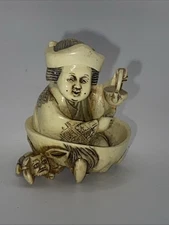 PEM Netsuke Hand Carved Man Holding Tea Pot and Dragon Face Figurine
