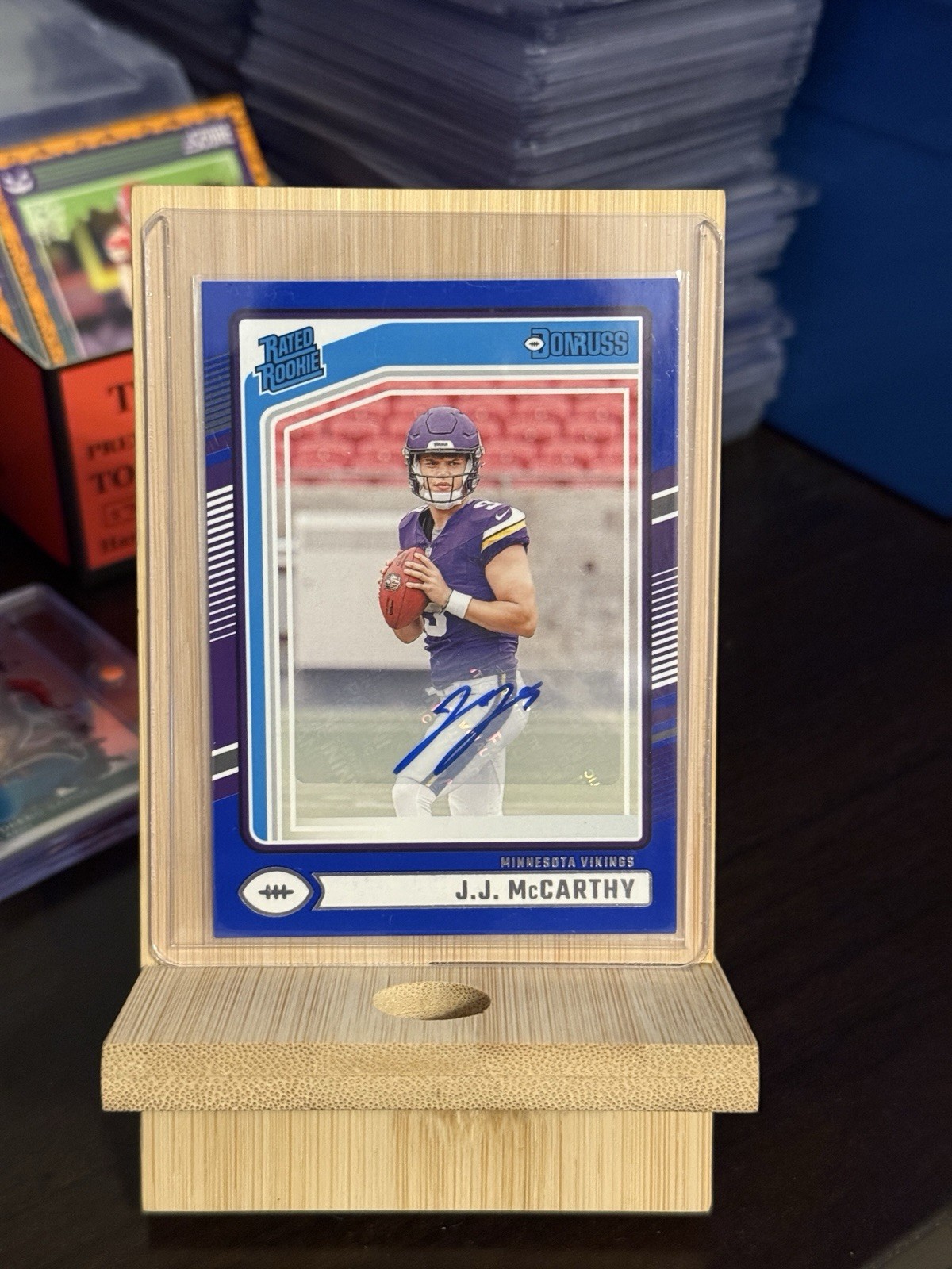 2024 Panini Donruss Rated Rookie J.J. McCarthy #303 Blue Autographs (AU, RC)
