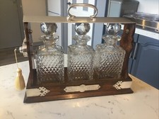 A SUPERB GENTLEMEN’S  ANTIQUE GOLDEN OAK CASED,THREE BOTTLE TANTALUS .CIRCA-1900