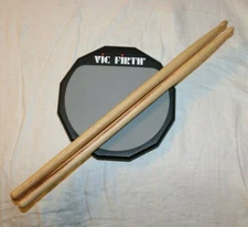 VIC FIRTH Single Sided Practice Pad 6" with Soft Surface Rubber & 2 Sticks