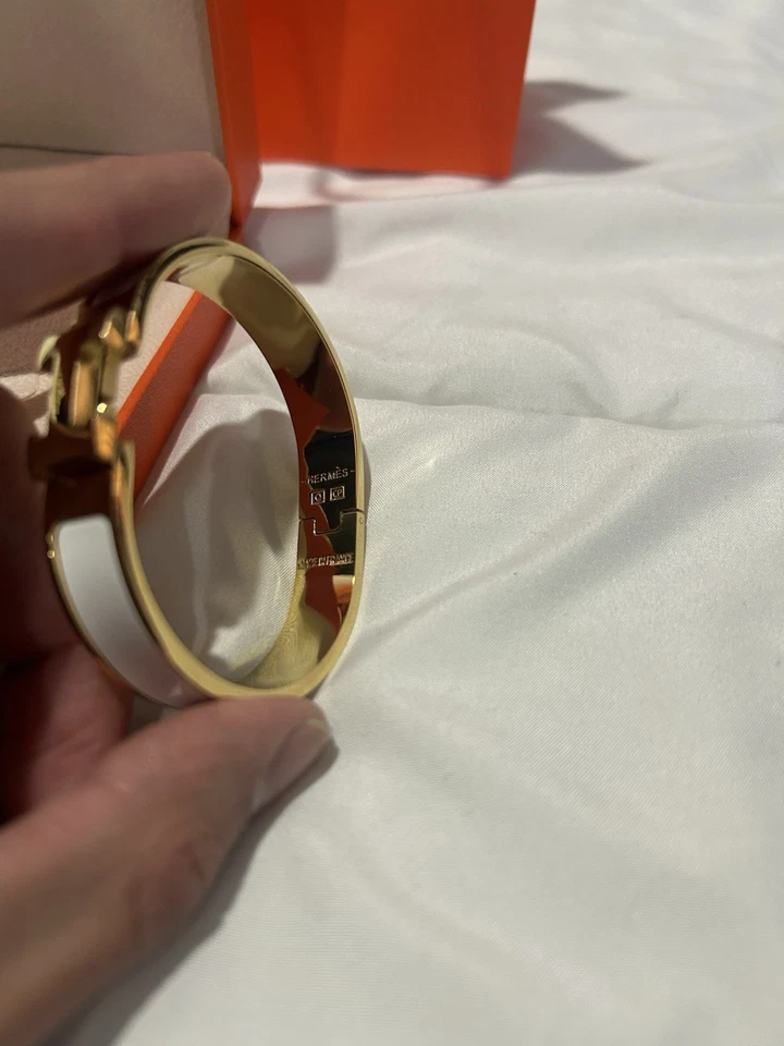 Brazalete brazalete Hermes Clic H dorado y blanco para mujer Foto 3 de 4