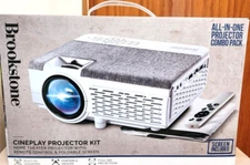 Brookstone Cineplay Projector Kit. All In One Bundle Pack Remote And Screen NIB