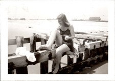 1940s Seaside Swimsuit Photograph Woman Applying Lotion on Wooden Dock
