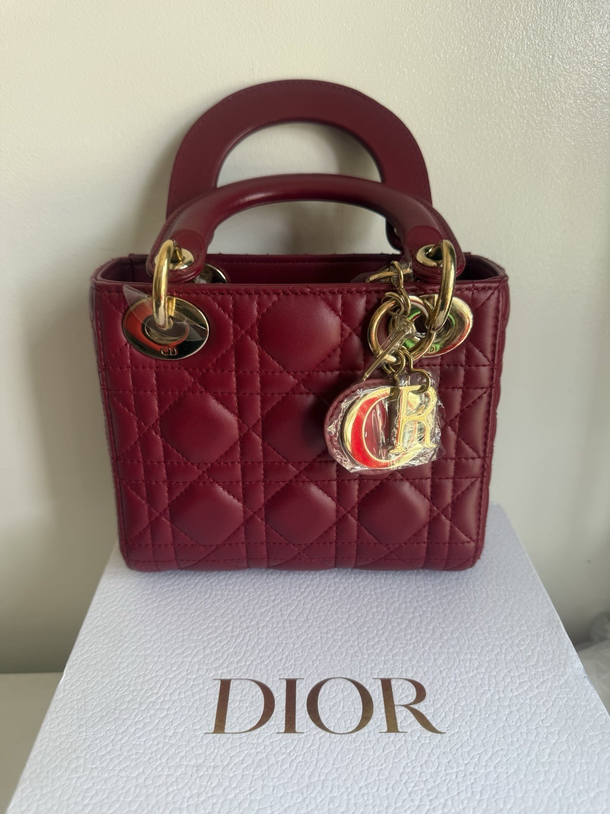 Christian Dior Mini Lady Dior bag in cherry red lambskin leather with Gold chain