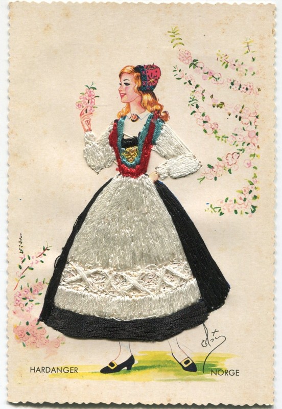 Woman in costume Hardanger embroidered in white, black, red, blue & gold thread