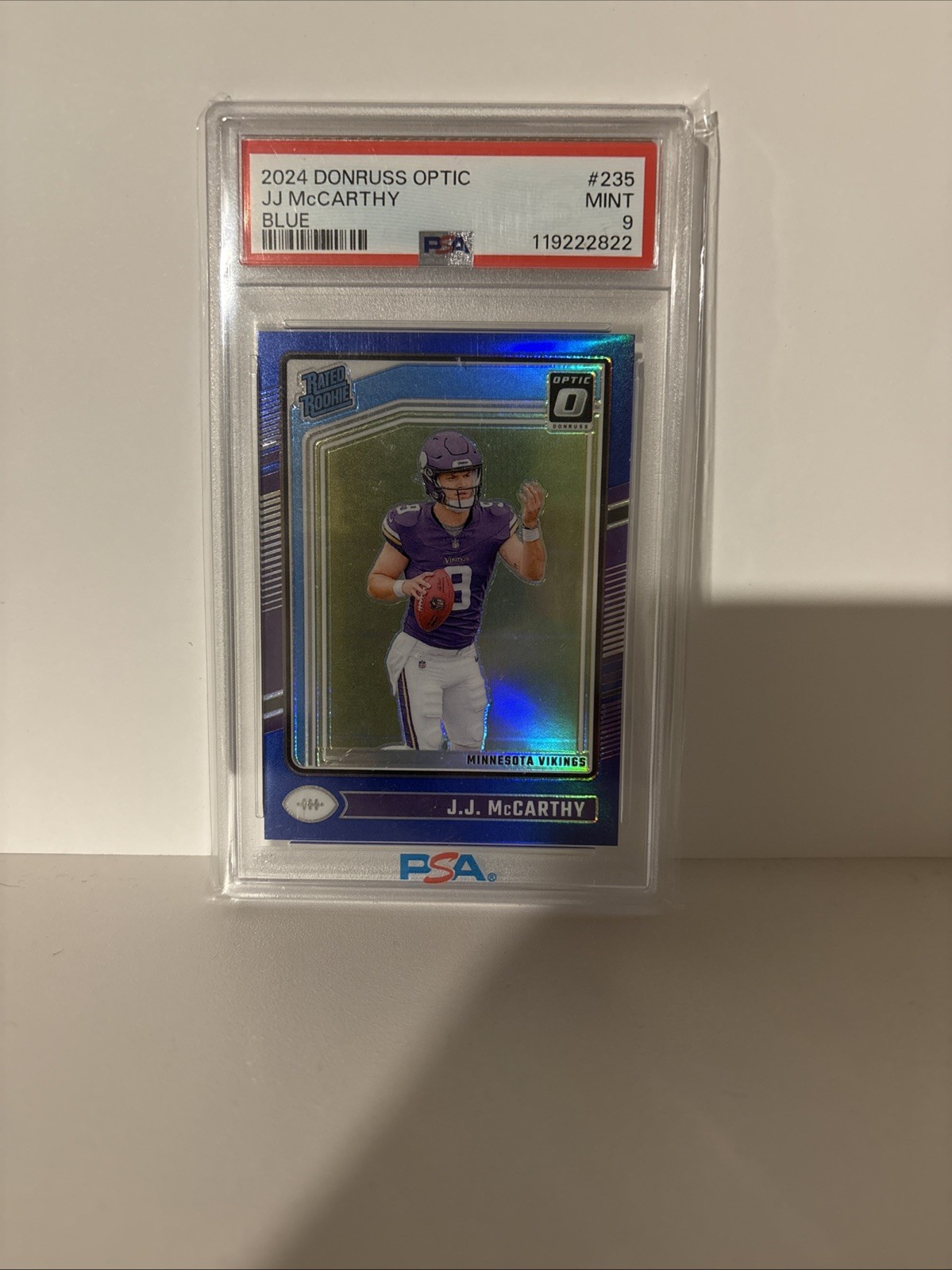 2024 Panini Donruss Optic -Rated Rookie J.J. McCarthy #235 Blue Prizm /199 PSA 9