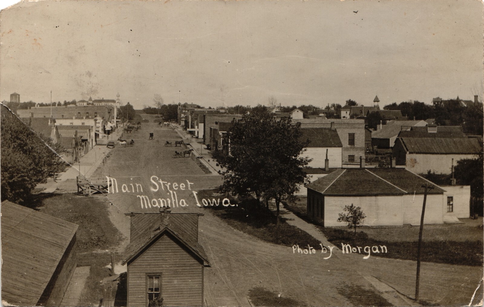 MAIN STREET VIEW real photo postcard rppc MANILLA IOWA IA craford