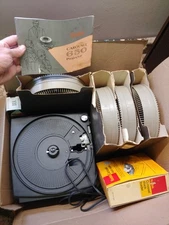 Kodak 650 Projector Lot: Turns On. Stack Loader. 100 Slide Wheel. Remote