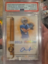 2023 Panini Gold Standard - Gold Fingers Amon-Ra St. Brown #GF-AR White Gold /49