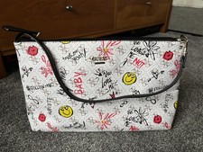 GUESS White Bag With Smiley Faces And Scribble Writing.