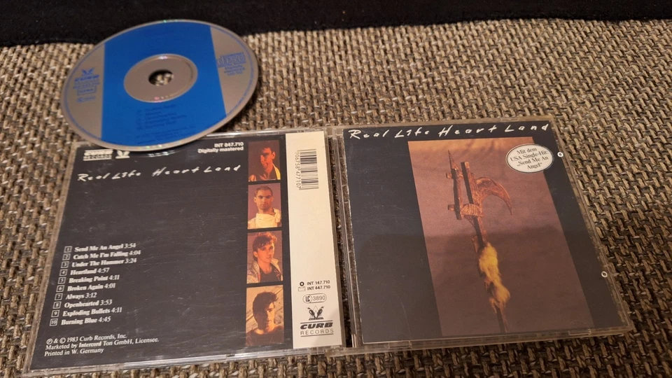 Real Life - Heartland (CD Curb / Intercord West Germany ; Blauer Balken)