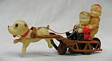 Vintage Wind Up Tin & Celluloid Dog Pulling Sled with Children