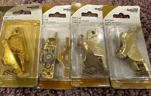 (4) NATIONAL H/W SASH LOCKS BRASS FINISH V601 N170-779