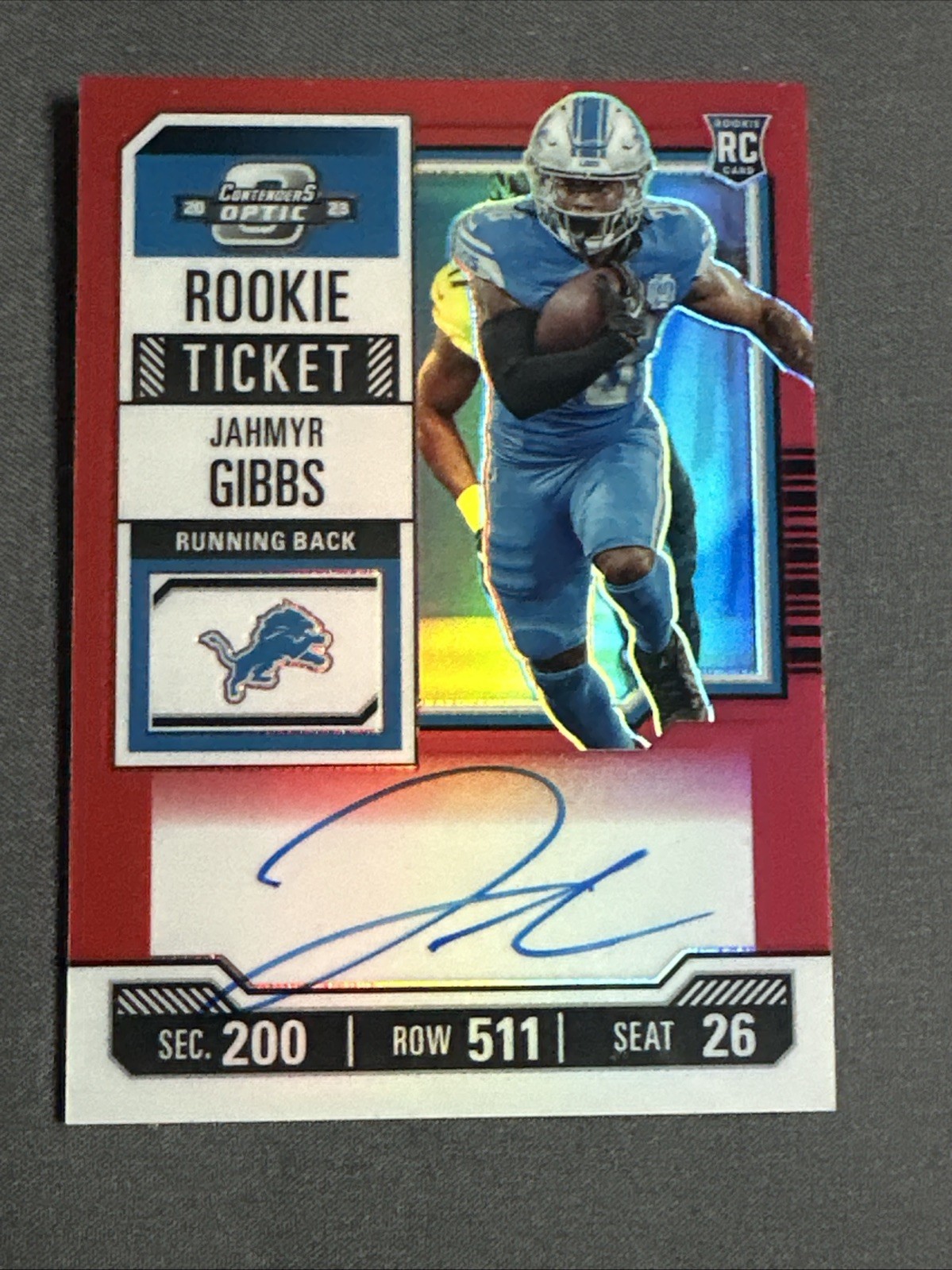 2023 Contenders Optic Jahmyr Gibbs RC Rookie Ticket Auto Red /125💥Lions Perfect