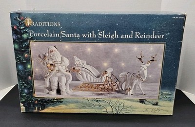 Traditions White Porcelain Santa With Sleigh and Reindeer With Gold Accents