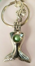 Decorative key chain with mermaid tail, pearl pendant and mint green tassel