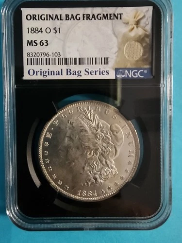 1884-O NGC MS63 Morgan Silver Dollar **With Original Bag Fragment** 