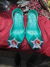 Disney Princess Ariel costume shoes, typically worn for dress-up or Halloween.