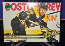 2025-26 Upper Deck Series 1 John Beecher Green Holiday Edition #10 Bruins