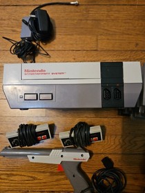 Nintendo NES Console Lot with 2 Controllers, 1 Zapper, 7 Games, and Cords